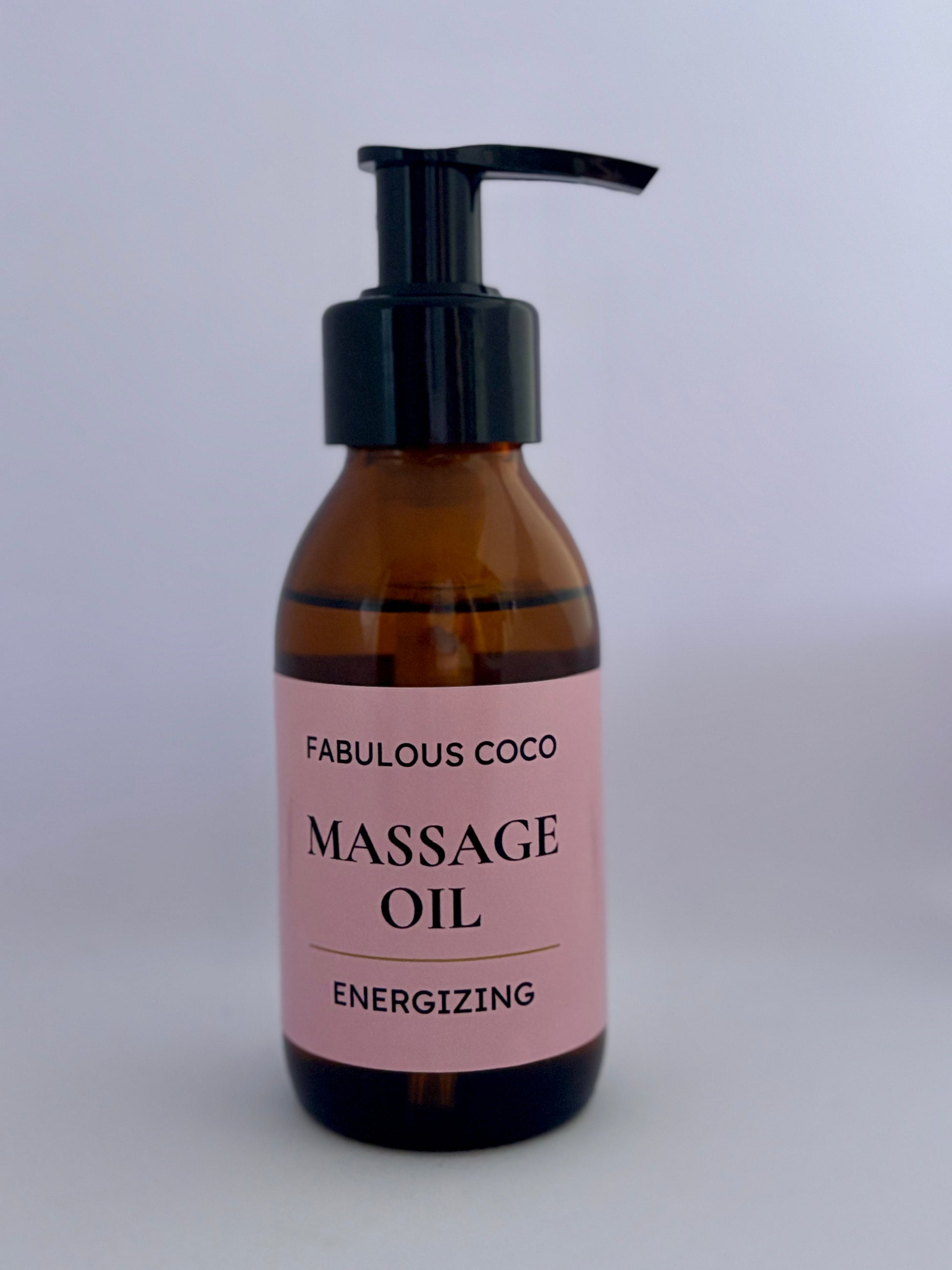 Energizing Massage Oil in a 100ml amber bottle with a black pump on a white background.
